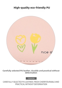 Detail of pink PU leather wallet with printed yellow tulips and smooth texture surface