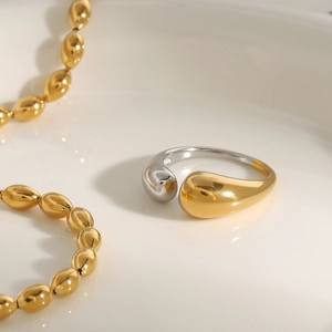 Minimalist gold and silver two-tone teardrop open ring made of polished stainless steel