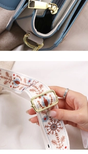 Detailed view of color-block shoulder bag with ethnic snowflake embroidery strap