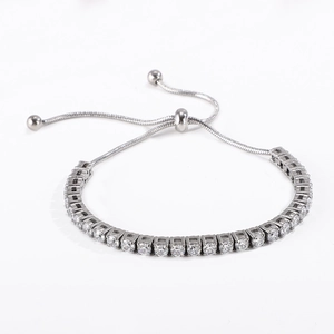 Close-up of adjustable silver tennis bracelet with round clear cubic zirconia stones