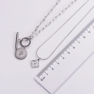 Detailed measurement of silver titanium necklaces with coin and clover pendants
