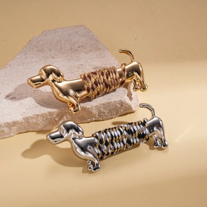 Metallic dachshund brooches in gold and silver finish with colorful woven rope detailing