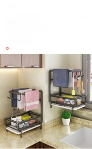 Close-up of dark grey kitchen sponge holder with towel bar and white drain tray