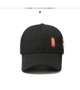 Front view of black baseball cap with red seal-style embroidery and colorful side accents