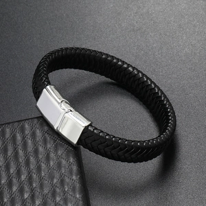 Detailed view of black woven leather bracelet with polished silver magnetic clasp closure
