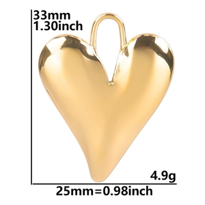 Macro view of gold heart pendant detailing dimensions 33mm by 25mm and 4.9g weight