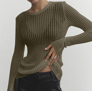 Detail of olive green ribbed knit top featuring breathable vertical stripe texture
