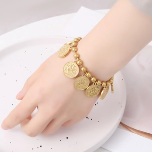 Gold coin charm bracelet with beaded chain featuring vintage 1901 embossed pendants