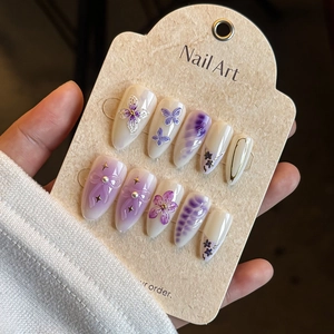French almond press-on nails with 3D purple flowers, butterflies and pearl accents
