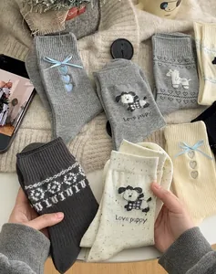 Detailed knit of cozy cotton socks featuring cute puppy embroidery and floral patterns