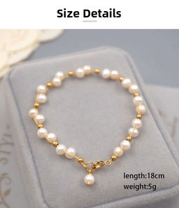 Detail of freshwater pearl bracelet with gold beads on grey velvet jewelry box