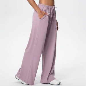 Detail of grey-purple wide leg pants with elastic drawstring waist and side pockets