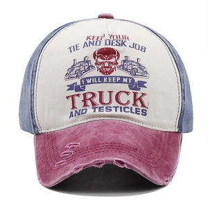 Detail of vintage washed cotton baseball cap with distressed brim and truck graphic