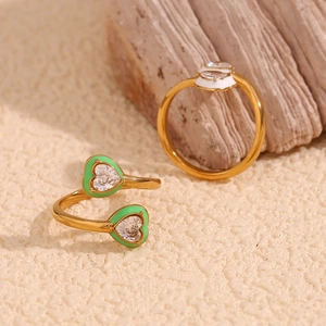 Gold plated stainless steel heart rings with green enamel and sparkling zircon accents