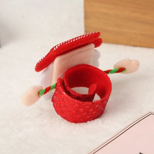 Detail showing a festive red sequin Christmas slap bracelet with snowman motif on fur background