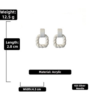 Detail view of acrylic twist square earrings showing dimensions 4.3cm by 2.8cm and 12.5g weight