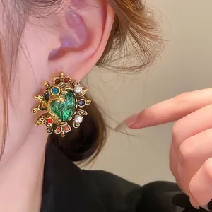 Vintage Baroque emerald earrings with gold metal crown, pearls, and colorful crystals