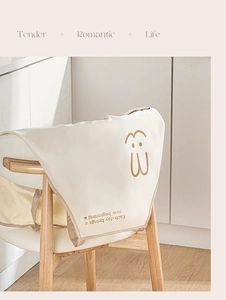 Waterproof kitchen apron detail featuring cute rabbit print and motivational quote