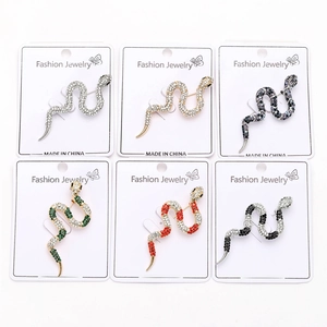 Selection of six colorful rhinestone snake brooches in gold and silver finishes