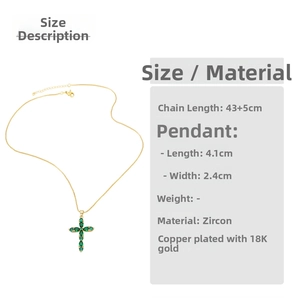 Detailed view of gold cross pendant with green drop-shaped zircons and dimensions