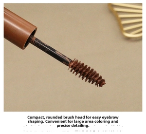 Macro shot of small dense spiral brush head with brown eyebrow tint for precise shaping