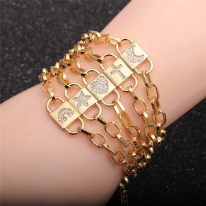 5-piece gold zircon bracelet set with moon, cross, heart and star charms on model