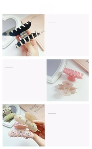 Detailed views of acetate hair claw clips with rhinestones and bow patterns