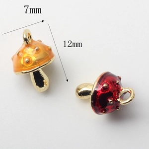 Miniature red and orange mushroom charms in alloy enamel with 7mm by 12mm dimensions