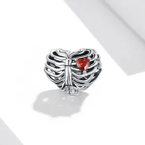 Gothic 925 sterling silver ribcage heart charm with red cubic zirconia stone