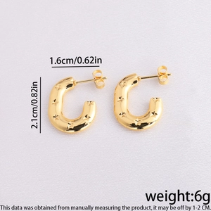 Detailed view of gold C-shaped earrings with star patterns and 2.1cm height dimensions
