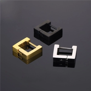 Detail of square stainless steel hoop earrings in gold, silver, and black polished finishes