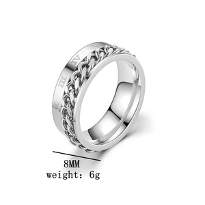 Detail of 8mm spinning silver ring with roman numeral engraving and chain inlay