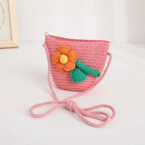 Pink woven straw crossbody bag for girls with decorative floral applique and zipper