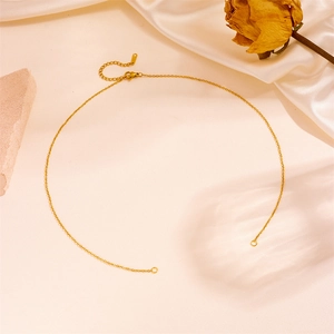 Close-up of gold lobster clasp and extension chain on 18k plated stainless steel necklace