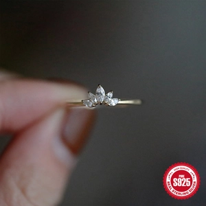 Macro shot of S925 sterling silver gold crown ring with marquise cut cubic zirconia