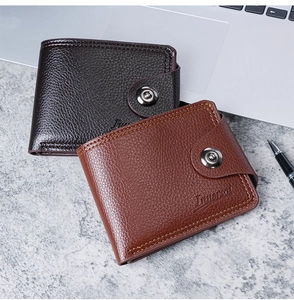 Detailed view of men's short wallets in brown and black leather with snap closure