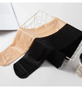 Detailed view of glossy nude and black tights neatly folded in a white wire basket