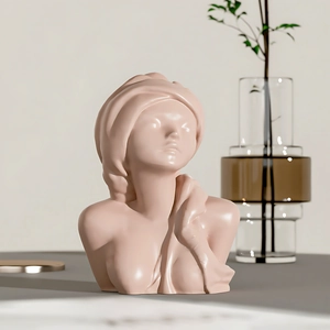 Detail of female bust statue in soft nude pink resin for candle mold and decor