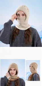 Detail of beige fleece-lined knit winter hat with integrated mask and neck warmer