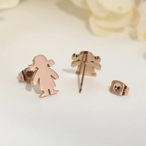 Detailed close-up of rose gold little girl stud earrings with matching backings