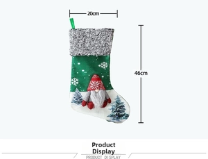 Detail of green Christmas gnome stocking featuring soft gray plush cuff and hanging loop