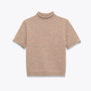 Chic beige short sleeve knit sweater with a turtleneck and delicate rolled edge details