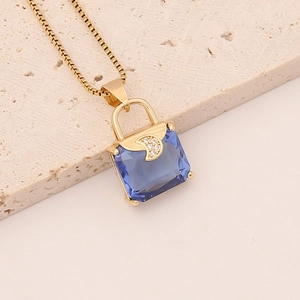Golden handbag pendant necklace with blue square crystal and crescent moon detail