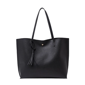 Minimalist black lychee texture tote bag with tassel charm and gold magnetic closure