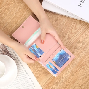 Pink PU leather tri-fold mini wallet with multiple card slots and clear ID window