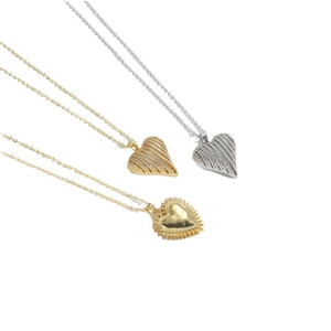 Minimalist heart pendant necklaces in gold and silver with sparkling diamond accents
