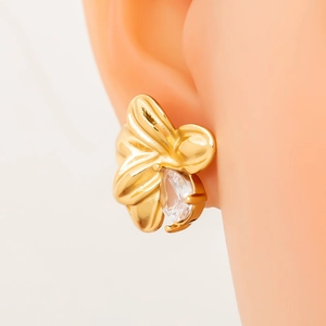 Elegant 18K gold flower stud earrings with a sparkling teardrop crystal on a model