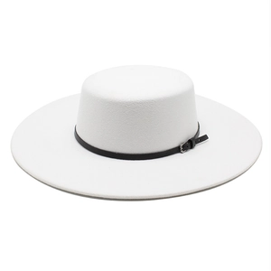 Detail of white wool felt boater hat featuring a black leather band with a metal buckle