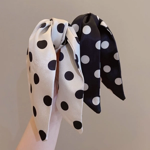 Set of 2 silk-like polka dot bow hair clips in black and cream white colors
