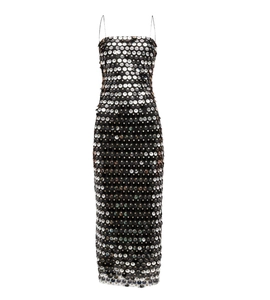 Close-up of large round silver sequins on a sexy slim fit black spaghetti strap dress